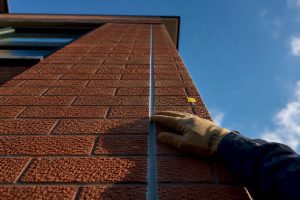 Fresh sealant bead in brick expansion joint