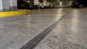 Sealed expansion joint across garage floor