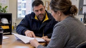 Property manager reviewing sealant warranty terms